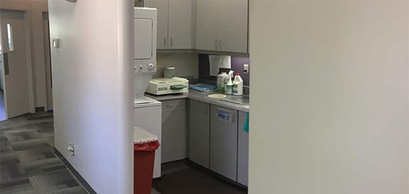 Work area for Marin Reconstructive Periodontics showcasing sterilization machines